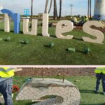 ELS ALUMNES D'OBRA REINSTAL·LEN LES LLETRES DE NULS A LA ROTONDA D'ACCÉS AL MUNICIPI